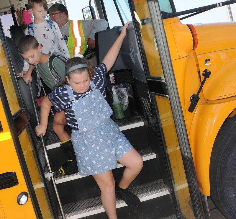 Students get off the bus Wednesday, Aug. 16, 2023, at Centennial School in Streator to begin the new school year.