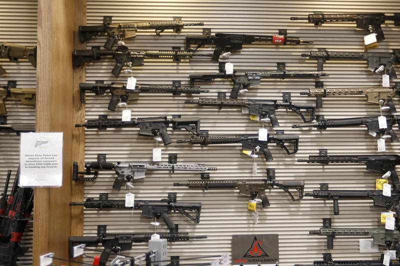 Guns for sale at Second Amendment Sports, in McHenry, on Thursday, Dec. 1, 2022. Democrats  in the state Legislature unveiled a plan that would immediately outlaw the sale of assault weapons and prevent most residents under 21 from legally buying a gun.