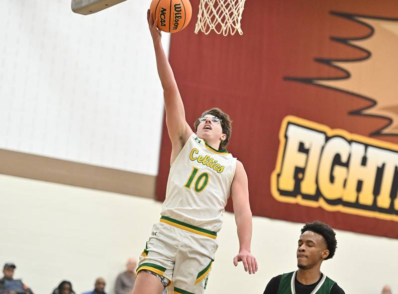 Providence Catholic's Cade Styrsky (10) makes a layup on a fast break during the WJOL tournament game against Plainfield Central's on Friday, NOV. 28, 2025, at Joliet.