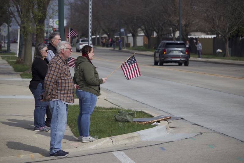 Attendees at the funeral procession on Friday, April 18, 2025, outside Tezak Funeral Home in Joliet, for for U.S. Army Staff Sgt. Jose Dueñez Jr. He was one of four soldiers who died March 31, 2025 when their armored vehicle sunk in a bog during a training mission in Lithuania.