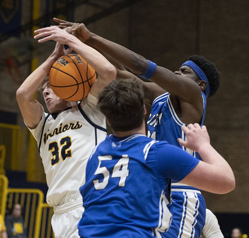 Sterling’s Jack Saathoff works to secure a loose ball against Quincy’s Milton Whitfield Friday, Jan. 30, 2026.