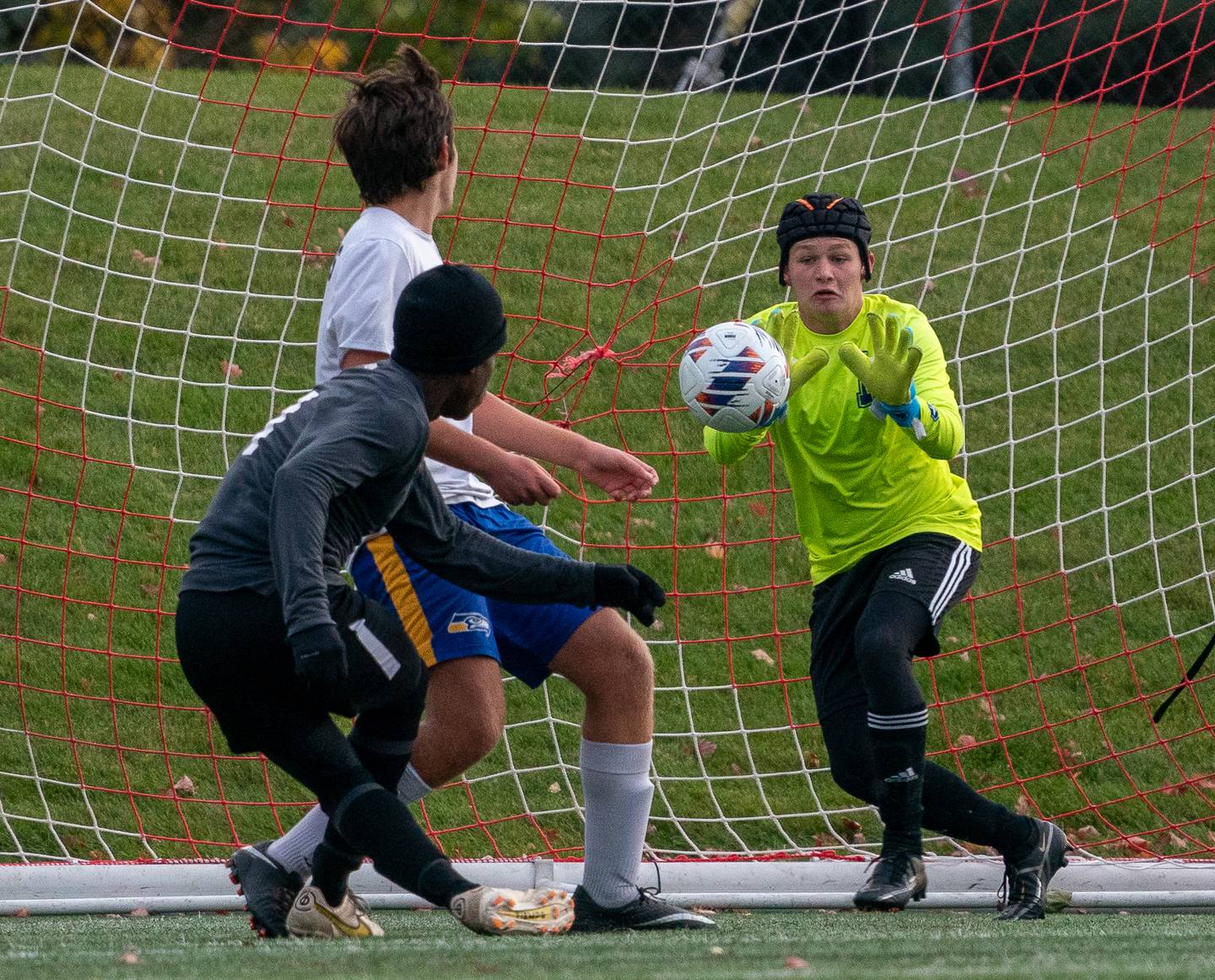 Wheaton Academy's Josiah Pitts (11) shoots the ball against Johnsburg's Preston Michel (1) during a Wheaton Academy 1A sectional semifinal match at Wheaton Academy on Tuesday, Oct 18, 2022.