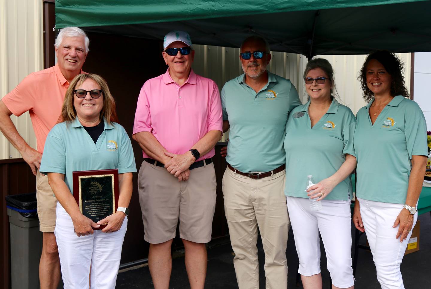 Dave Burroughs, Denise Migliorini, Pete Wallers, Rick Williams, Shari Frieders and Nicole Pryor at the Between Friends Food Pantry of Sugar Grove ribbon cutting on Aug. 5, 2025.