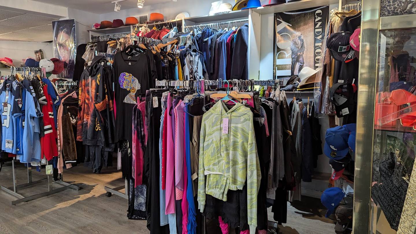 Fashionable clothing hangs from racks at Candy Kouture in Joliet on Tuesday, Feb. 25, 2025.