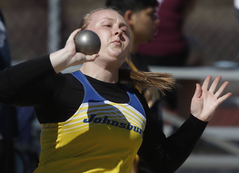 Johnsburg’s Chloe Benz throws the shot put as she competes Thursday, April 21, 2022, during the McHenry County Track and Field Meet at Richmond-Burton High School.