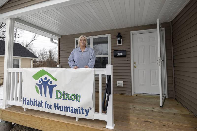 Just minutes after the dedication Megin Steeb will start to move in her furnishings to her new Habitat for Humanity home Sunday, Dec. 22, 2024, in Dixon. Steeb will live in the home with her daughter Mackenna Muhammad, 12.