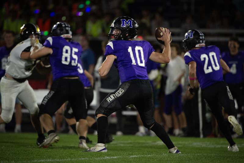 Manteno's Connor Harrod steps back to pass in a game against Herscher on Friday, September 12, 2025.