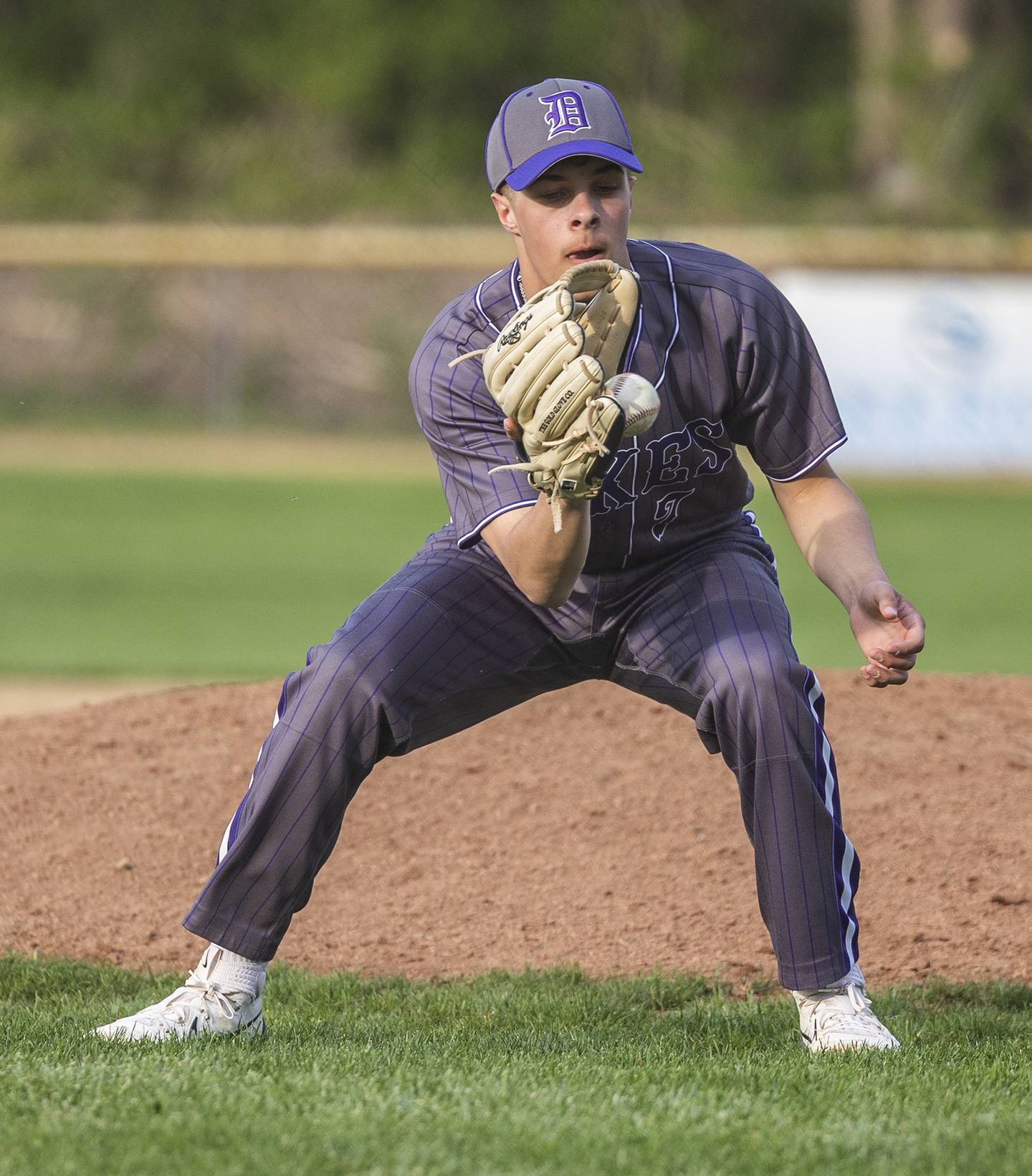 Dixon’s Eli Kirchoff fields a ball off the mound against Oregon Thursday, April 24, 2025.