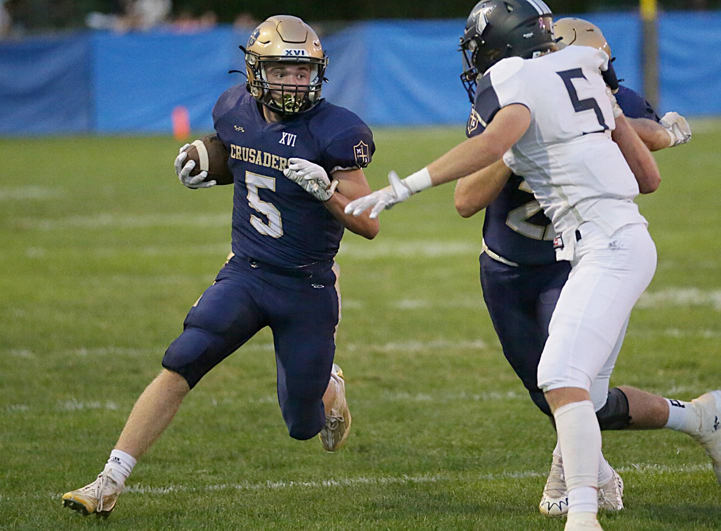 Marquette's Tom Durdan (5) runs the ball up the field against Wethersfield on Friday, Sept. 16, 2022 at Gould Stadium in Ottawa.