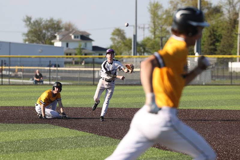 Manteno’s Tyler Buehler looks to turn a double play after forcing out Herscher's Gaige Brown at second base during the Panthers’ 8-7 victory over Herscher on Tuesday, May 6, 2025.