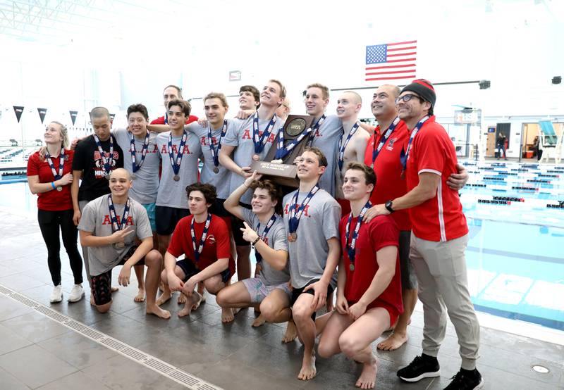 Hinsdale Central swimmers celebrate their second-place finish in the IHSA Boys Swimming and Diving Championships at FMC Natatorium in Westmont on Saturday, Feb. 26. 2022.