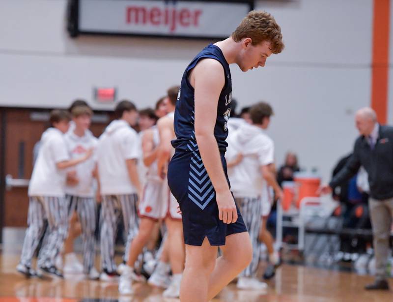 Lake Park's Thomas Rochford (30) walks off dejected after missing the final shot of the game allowing for the Wheaton Warrenville South 42-41 overtime win on Saturday, Jan. 7, 2023.
