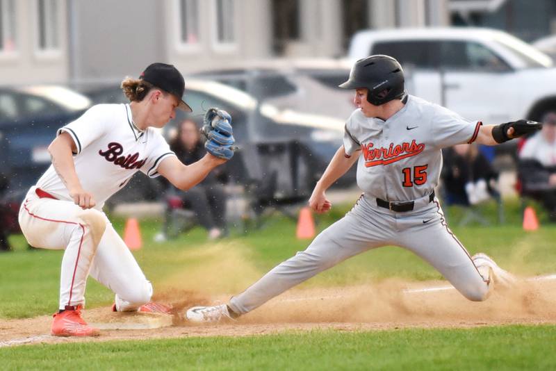Lincoln-Way West's Quentin Lange, right, slides into third base ahead of a tag from Bradley-Bourbonnais' Cody Freitas during a game at Bradley-Bourbonnais Thursday, May 1, 2025.