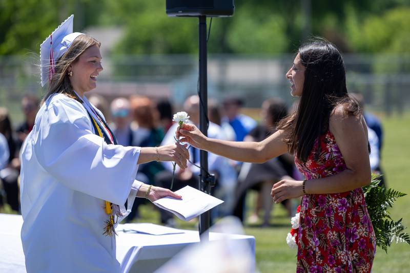 Mady Ponsetti receives flower on Sunday, May 18, 2025 at Hall High School in Spring Valley.