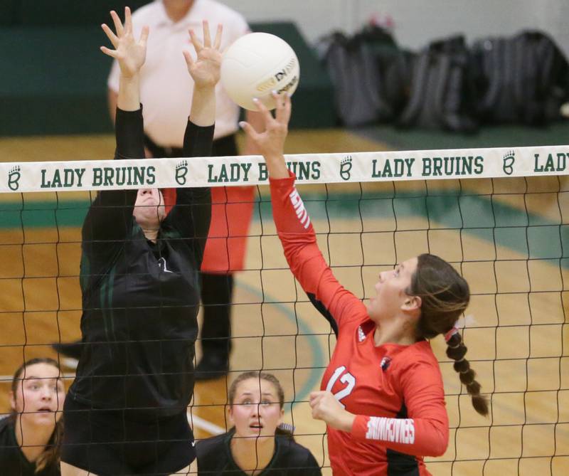 Henry's Kaitlyn Anderson (12) sends the ball past St. Bede's Reagan Stoudt in the Class 1A semifinal game on Wednesday, Oct. 16, 2022 at St. Bede Academy in Peru.