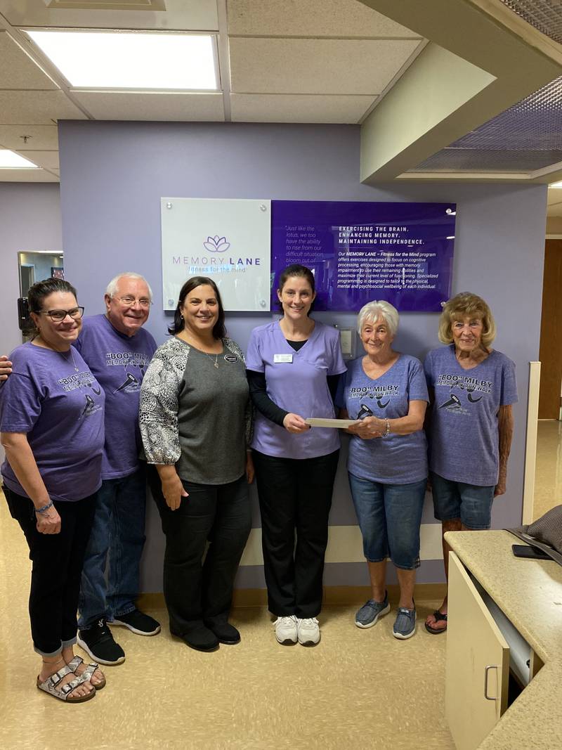 The Illinois Valley Alzheimer's Group donated $500 to Liberty Village of Peru to be used for its Alzheimer's unit. Pictured from left at the Oct. 9, 2024, check passing are Wendy Mangelsdorf and Bob Frig, volunteers for the Illinois Valley Alzheimer's Group; 
Michelle Sommer, Liberty Village marketing director, Genna DeGroot, director of Memory Court, Joanne Milby and Peg Gonet, co-directors of the Illinois Valley Alzheimer's Group.