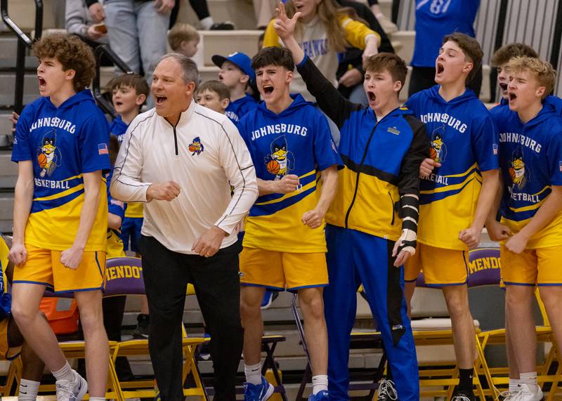 The Johnsburg High School bench celebrates a three point basket during the IHSA 2A Sectional Championship game on March 6, 2026 at Mendota High School.