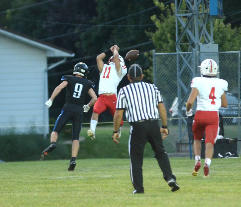 Oregon's Jayden Berry (11) jumps for a pass as Eastland-Pearl City's Kole Hauptman (9) defends during a practice game at Lanark on Friday, Aug. 22, 2025.