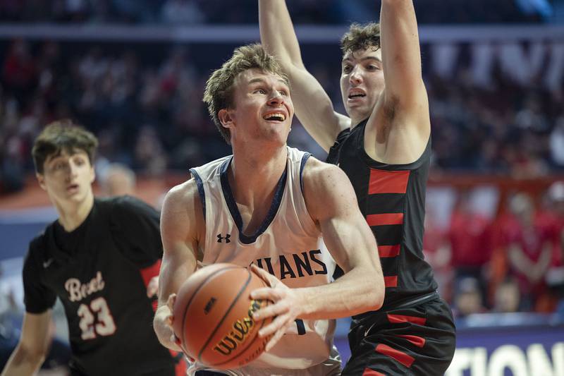 New Trier’s Jake Fiegen works below the basket against Benet Academy Friday March 10, 2023 during the 4A IHSA Boys Basketball semifinals.