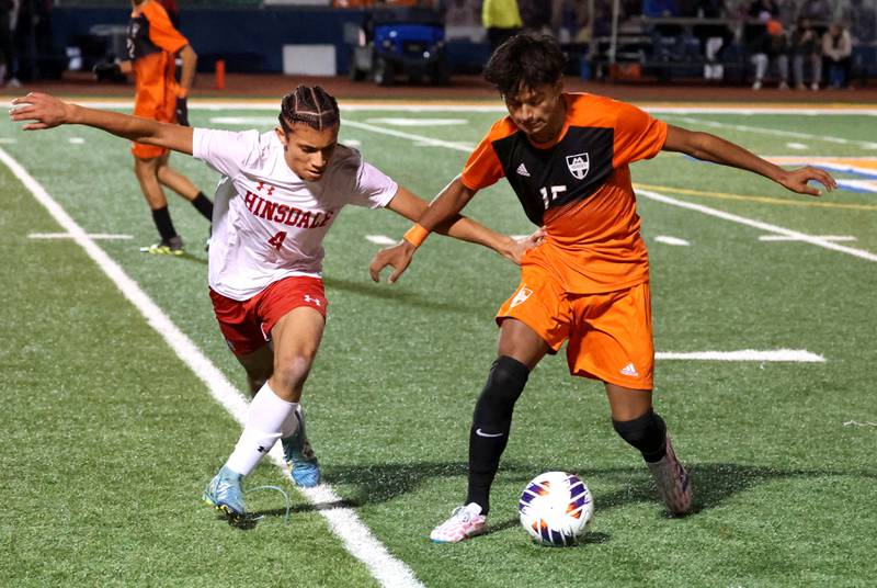 Hinsdale Central's Alex Barbu and Hersey's Diego Ortiz fight for possession Friday, Nov. 8, 2024, during their Class 3A state semifinal game at Hoffman Estates High School.