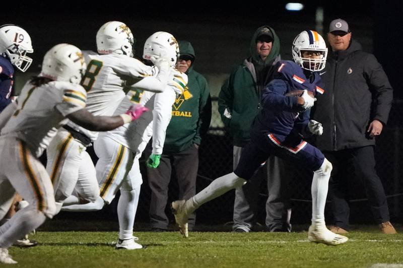 Oswego’s Jeremiah Cain (1) runs after intercepting a pass against Waubonsie Valley during a Class 8A first-round playoff game at Oswego High School on Friday, Nov. 1, 2024.