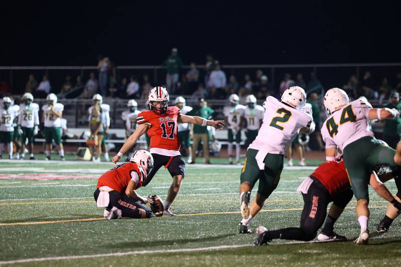 Bradley-Bourbonnais quarterback Ellis Johnson prepares to kick the extra point, held by Rylon McCue, during the Boilermakers' 35-6 victory over Waubonsie Valley Friday, Sept. 12, 2025.