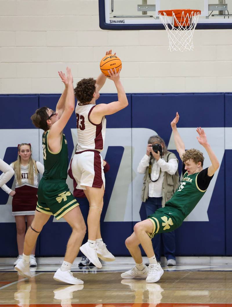 Bishop McNamara's Richard Darr, right, attempts to draw a foul late in the fourth quarter during the Fightin' Irish's 77-70 loss to Tolono Unity in the IHSA Class 2A Pontiac Supersectional on Monday, March 9, 2026.