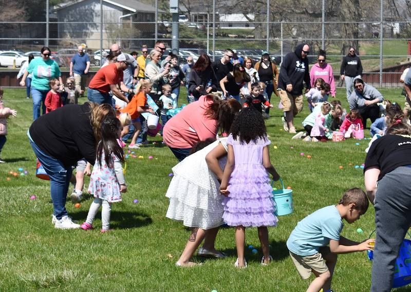 Kids and their parents collect eggs during the Coloma Park District egg hunt on April 12th, 2025.