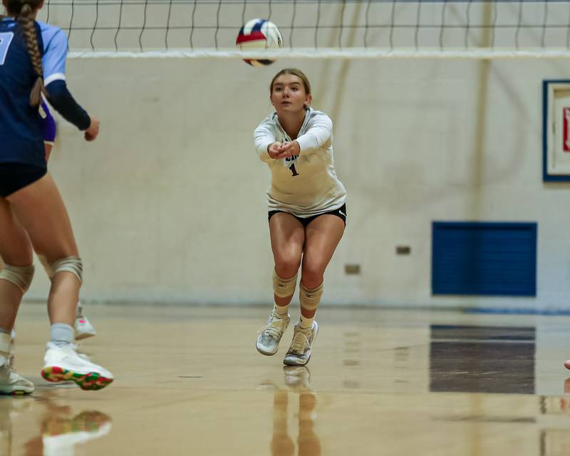 Downers Grove South's Leah Blaylock (1) with a dig off a serve during volleyball match between Downers Grove North at Downers Grove South.  Sept 7, 2023