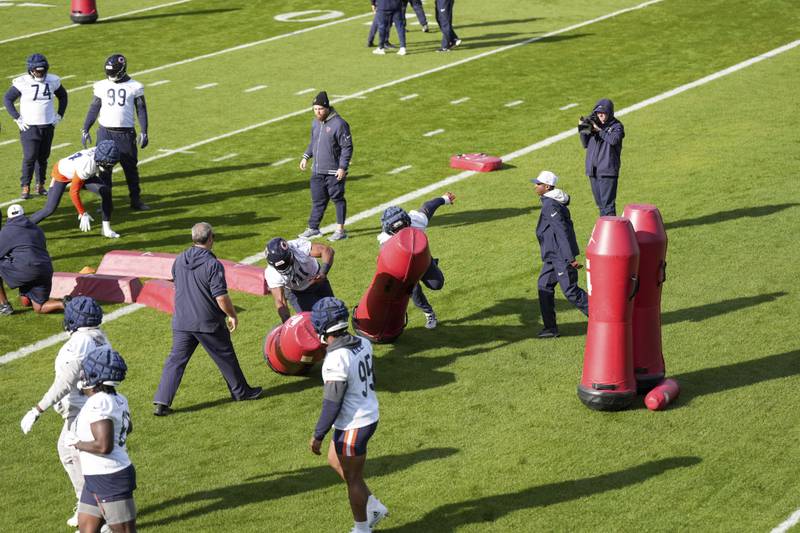 Chicago Bears defensive players run through drills, during a training session in Ware, England, Thursday, Oct. 10, 2024, ahead of the game between the Chicago Bears and the Jacksonville Jaguars at Tottenham Hotspur Stadium on Sunday. (AP Photo/Sean Ryan)