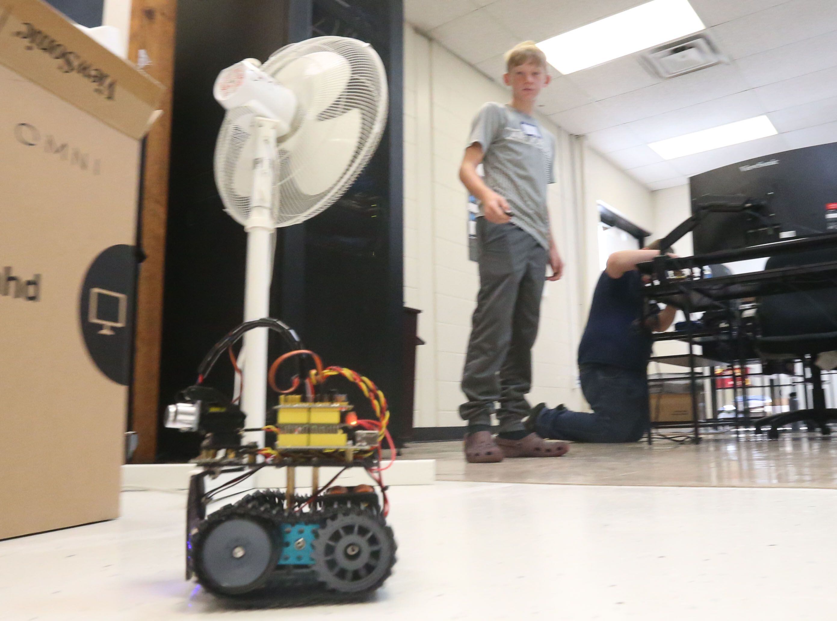 Alex Lovgren moves a robot he built in computer programing class during the Area Career Center's Summer Hands-On Showcase on Thursday, June 8, 2023, at La Salle-Peru High School. 