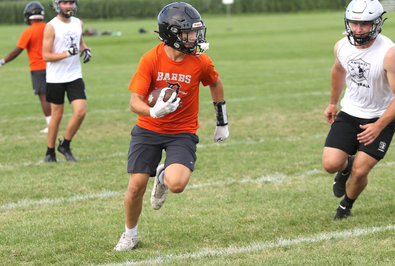 Kaneland and DeKalb players compete during 7-on-7 drills Tuesday, July 26, 2022, at Kaneland High School in Maple Park.