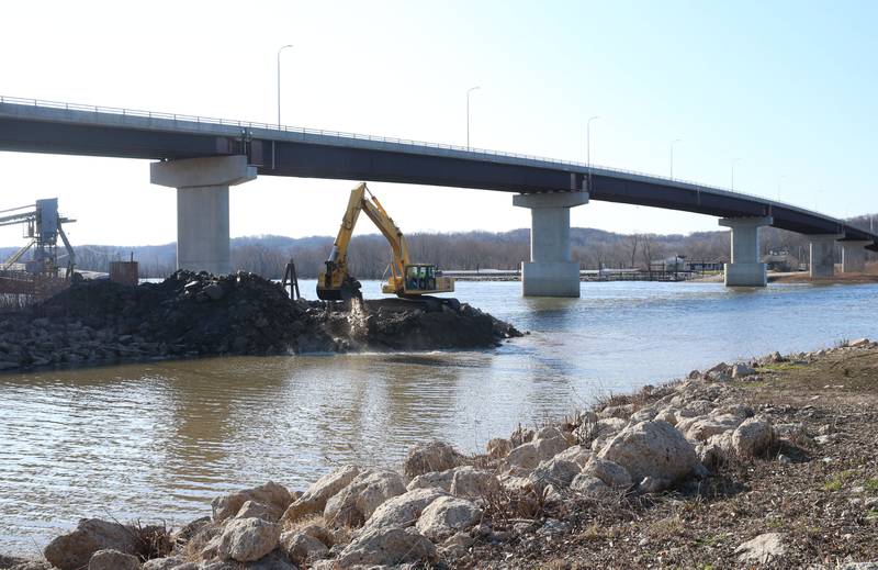 An excavator dredges the harbor at Barto Landing on Wednesday, March 26, 2025 in Spring Valley.