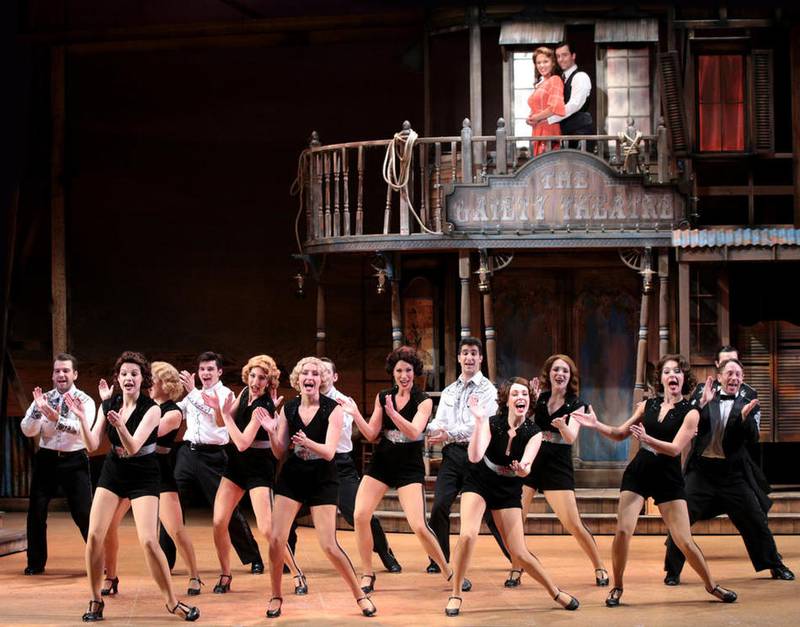 Robyn Hurder and Clyde Alves look down from a balcony in a scene from “Crazy For You” at Drury Lane Theatre.