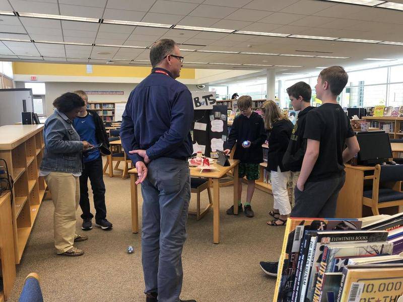 Cary School District 26 Superintendent Brian Coleman, curriculum director Valerie McCall and library media information specialist Kathleen DeRaedt help seventh-graders Drew Dimino, Derek Passaglia, Logan Ragland and PJ Weaver prepare for Tech 2019.