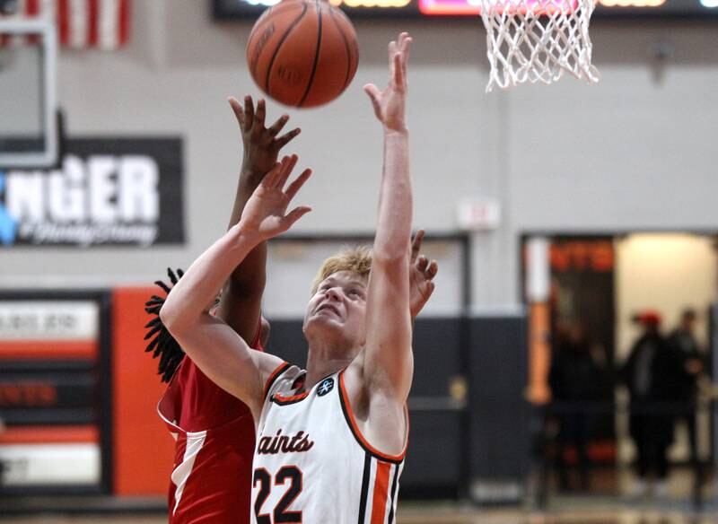St. Charles East’s Brad Monkemeyer (22) goes up for a rebound during a game against East Aurora in the 63rd Annual Ron Johnson Thanksgiving Tournament at St. Charles East on Monday, Nov. 21, 2022.