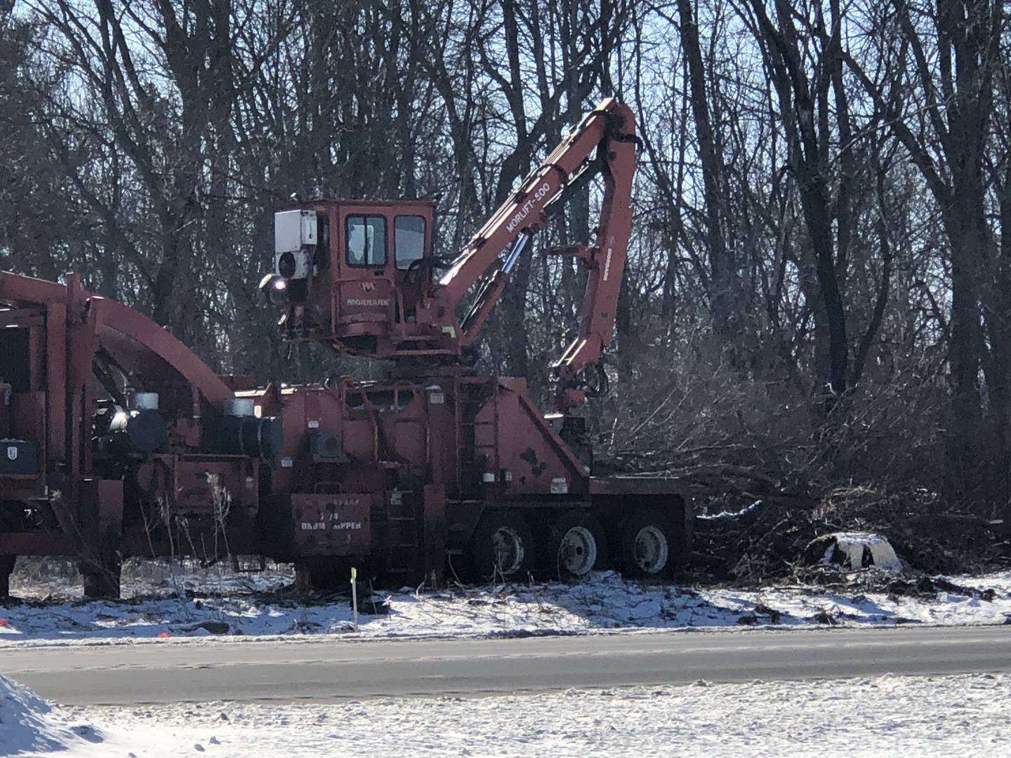 A crew removes trees on Thursday, Feb. 20, 2025 along Route 31 south of McHenry. The work is part of preparation for widening of the road, a project that is expected to be completed in 2030.