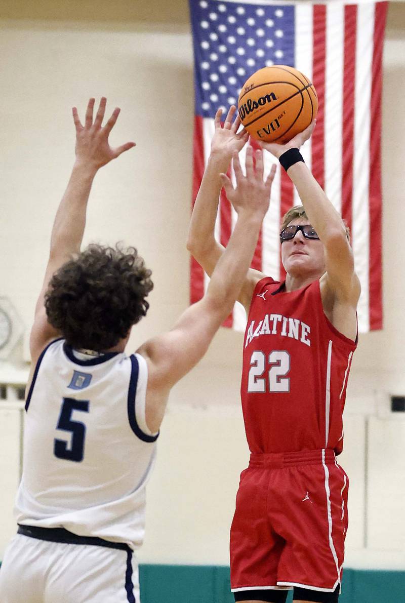Palatine’s Darrin Dick (22) shoots over Downers Grove South’s Wyatt Wawro (5) during the Jack Tosh Holiday Tournament Thursday, Dec. 26, 2024 at York High School in Elmhurst.
