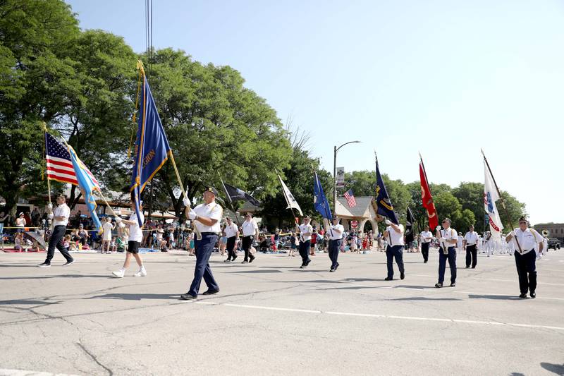 Representatives from La Grange American Legion Post 1941 lead the 77th Annual La Grange Pet Parade on Saturday, June 3, 2023.