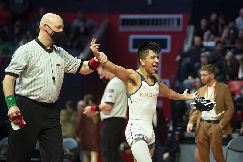 IC Catholic's Nick Renteria celebrates his win over Yorkville Christian's Isaac Bourge during the 1A 120lb finals match at the IHSA state wrestling meet on Saturday, Feb. 19, 2022.
