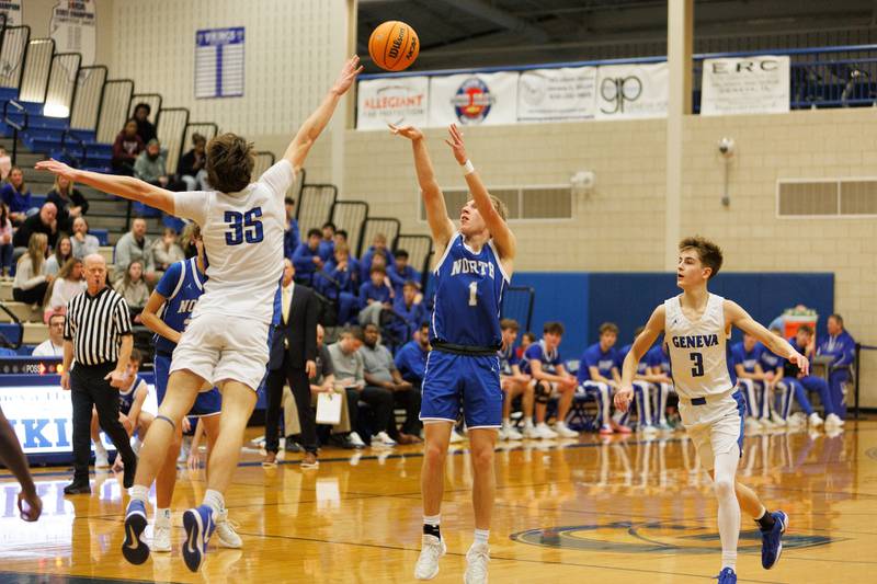 Wheaton North's Henry Schlickman shoots a jumper over Geneva's Mason Halbach on Friday, Feb.13,2026 in Geneva.