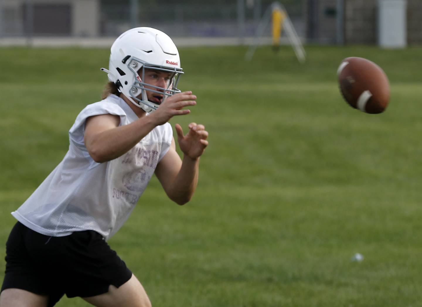 Hampshire’s Cole Klawikowski catches a pitched football during the first day of football practice Monday, August 7, 2023, at the Hampshire High School.