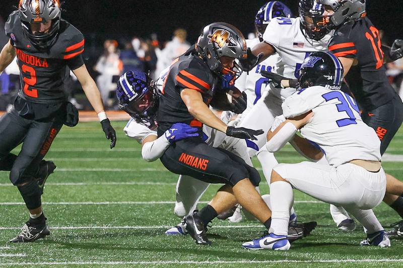 Lincoln-Way East’s Brayden Mortell brings down the Minooka runner on Friday, Nov. 8, 2024 in Minooka.