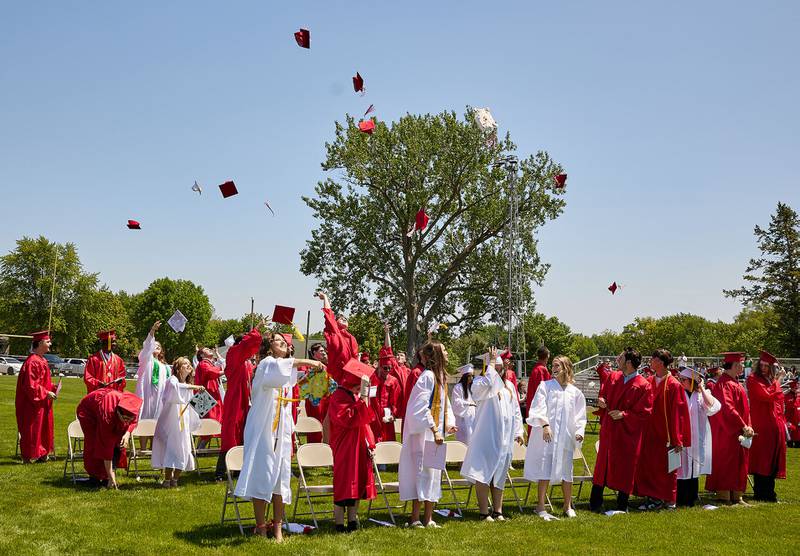 The Hall Class of 2023 throw their caps in the air after graduating during the graduation ceremony on Sunday May 21, 2023 at Hall Township High School.