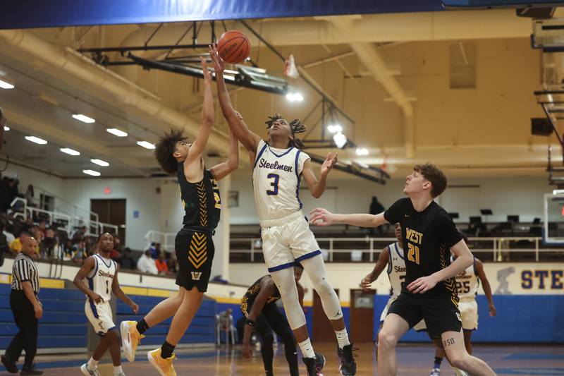 Joliet Central’s Glenn Harper goes up for the rebound against Joliet West on Saturday, Jan. 27th, 2024 in Joliet.