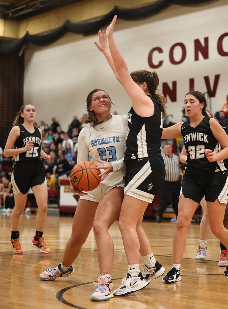 Nazareth's Danielle Scully (23) drives hard to the basket during the girls 3A varsity super-sectional game between Nazareth Academy and Fenwick High School in River Forest on Monday, Feb. 27, 2023.