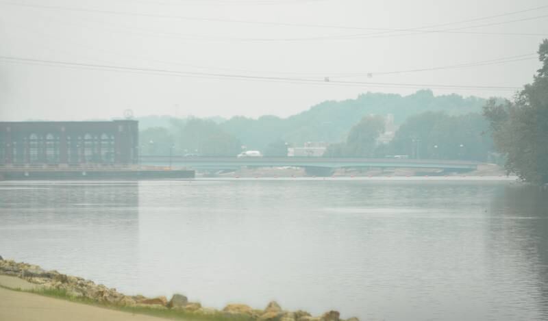 Haze from the wildfires in Canada have blanketed a portion of northern Illinois as evidenced by this early afternoon photo of the Rock River by the Dixon dam.