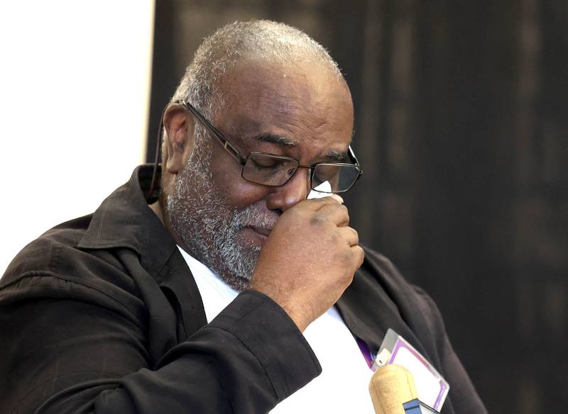 Leroy Mitchell becomes emotional as he listens to speakers honor him Friday, Aug. 8, 2025, during the grand opening celebration for the school that bears his name, Dr. Leroy A. Mitchell Elementary School in DeKalb.
