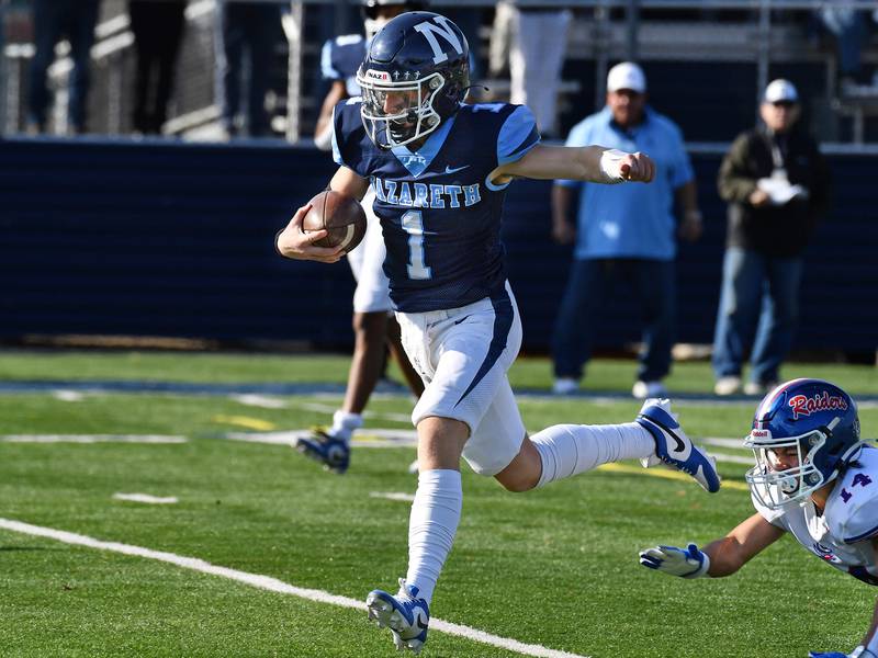 Nazareth quarterback Logan Malachuk (1) leaves the last Glenbard South tackler, Shaun Aderholt (14), behind on his way to the end zone for a touchdown during a Class 5A second round game on Nov. 4, 2023 at Nazareth Academy in LaGrange Park.