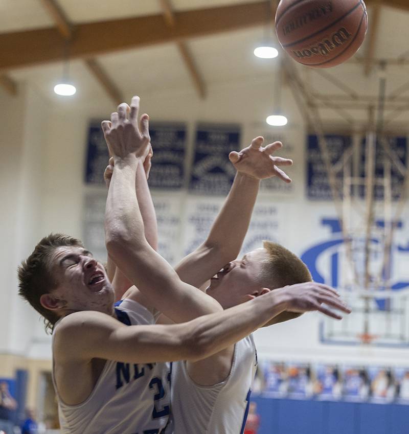Newman’s Cody Mcbride (left) and George Jungerman collide going for a rebound against Hall Friday, Feb. 2, 2024 at Newman High School.